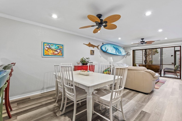 dining area with light hardwood / wood-style flooring, ceiling fan, and crown molding