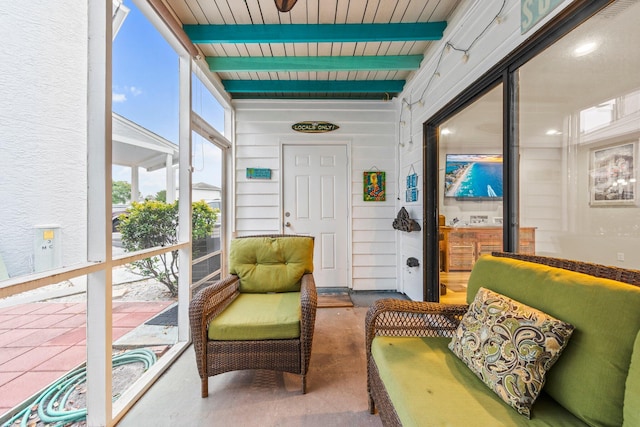 sunroom / solarium with beamed ceiling and wooden ceiling