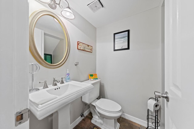 bathroom with toilet and sink