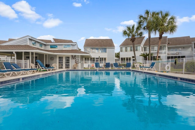 view of pool with french doors