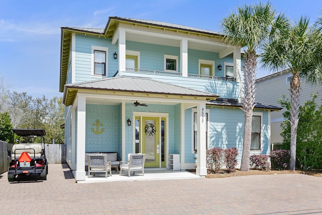 view of front of property featuring central AC unit and a porch