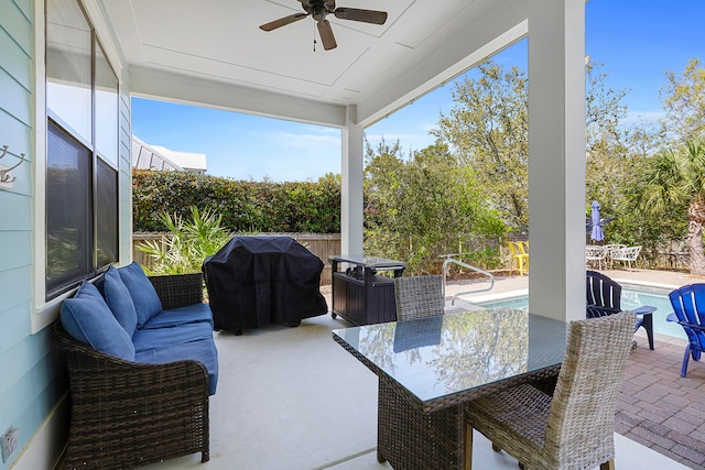 view of terrace with grilling area, an outdoor living space, ceiling fan, and a fenced in pool