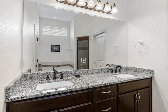 bathroom featuring double sink and large vanity