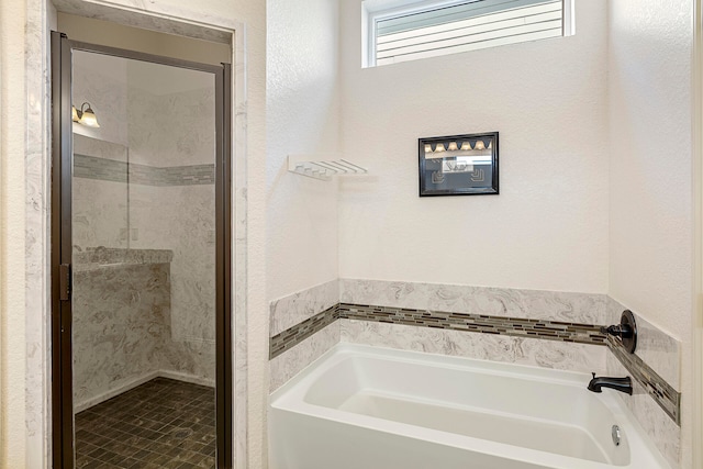 bathroom featuring plus walk in shower