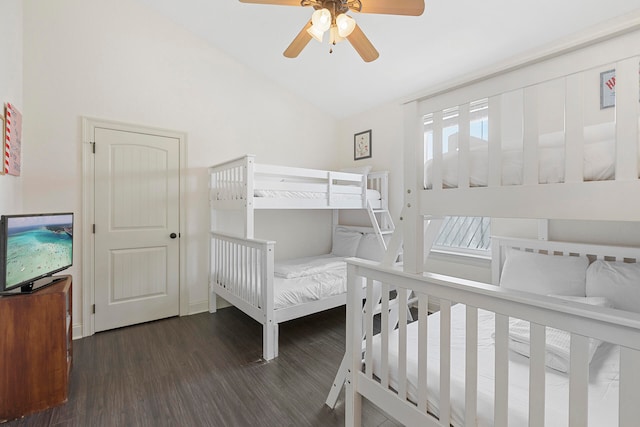 bedroom featuring ceiling fan, lofted ceiling, and dark wood-type flooring