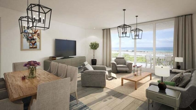 living room with a notable chandelier, a wall of windows, a water view, and hardwood / wood-style flooring