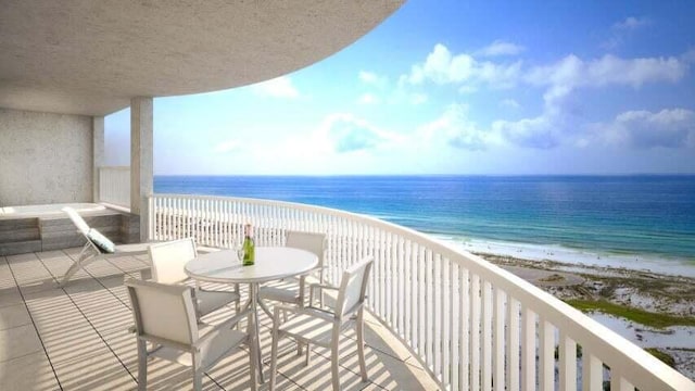 balcony with a beach view and a water view