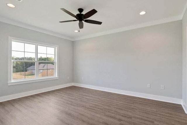 spare room featuring ornamental molding, dark hardwood / wood-style flooring, and ceiling fan