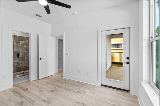 unfurnished bedroom featuring light hardwood / wood-style floors, ceiling fan, and ensuite bathroom