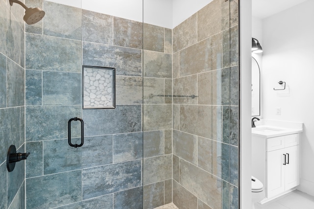 bathroom featuring tile flooring, an enclosed shower, and large vanity