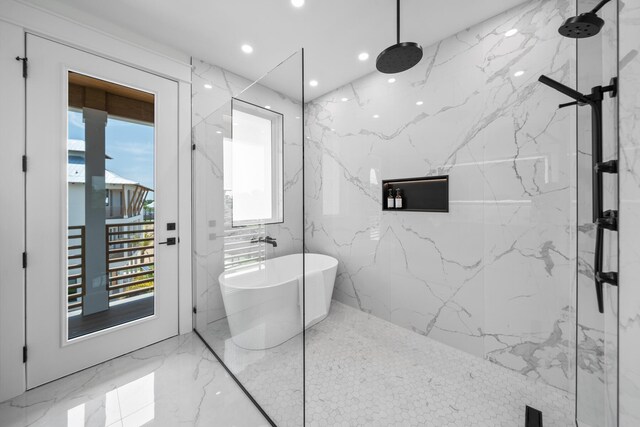 bathroom featuring shower with separate bathtub, tile walls, and a healthy amount of sunlight