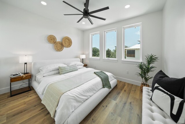 bedroom featuring wood-type flooring and ceiling fan