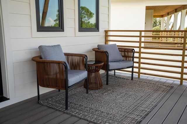 exterior space featuring wood-type flooring and wooden walls