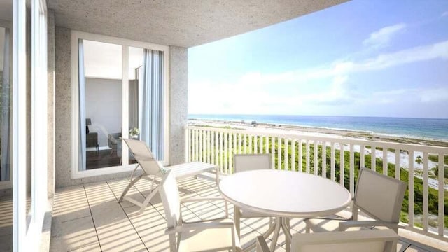 balcony with a beach view and a water view