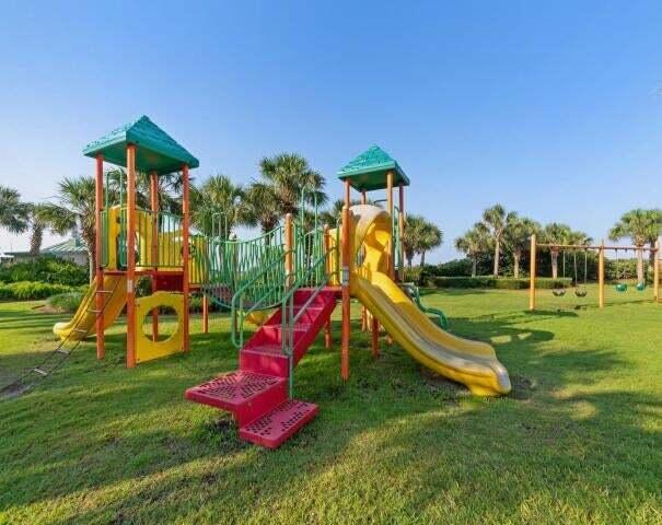 view of playground with a lawn