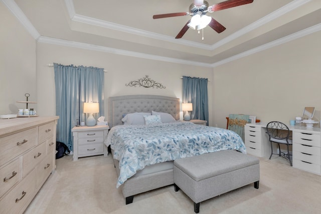 bedroom with light carpet, ornamental molding, ceiling fan, and a raised ceiling