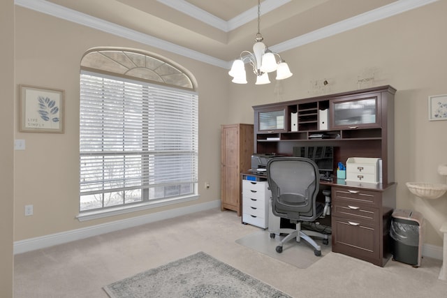 carpeted office space with a healthy amount of sunlight, crown molding, a notable chandelier, and a tray ceiling