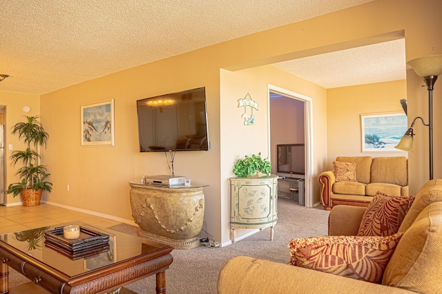 living room featuring light colored carpet and a textured ceiling