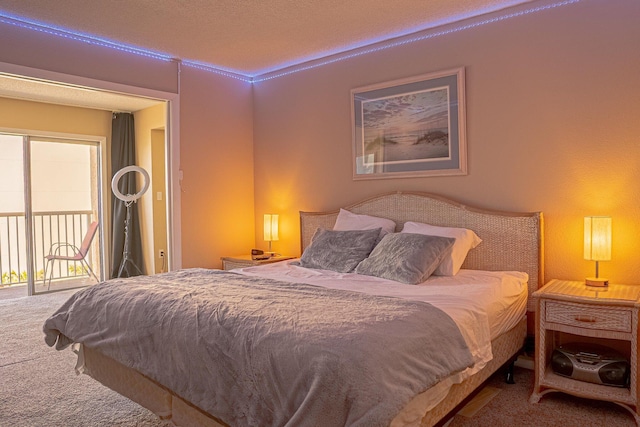 carpeted bedroom featuring access to outside