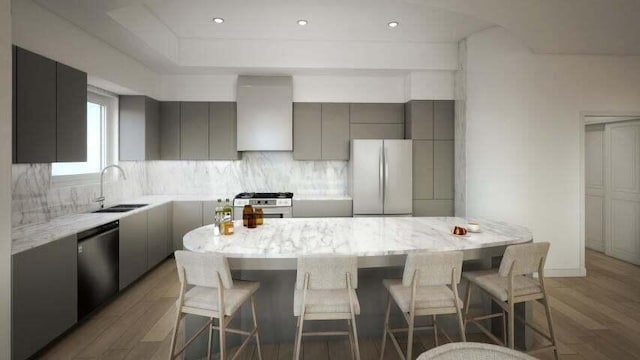 kitchen featuring a kitchen island, sink, backsplash, white refrigerator, and wood-type flooring