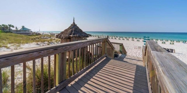 exterior space with a beach view and a water view