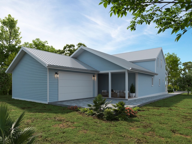 view of front of house featuring a garage and a front yard