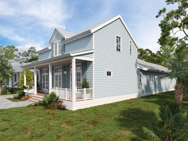 view of side of home featuring covered porch and a lawn