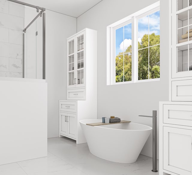 bathroom featuring a wealth of natural light, tile floors, and separate shower and tub