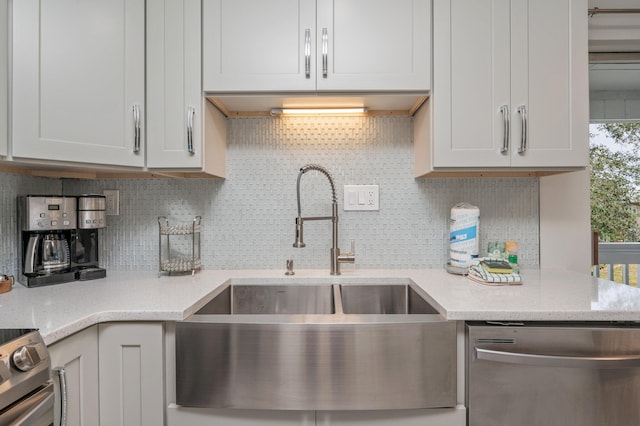 kitchen featuring a healthy amount of sunlight, dishwasher, tasteful backsplash, and range