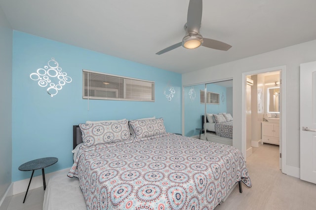 carpeted bedroom with a closet, ceiling fan, and connected bathroom