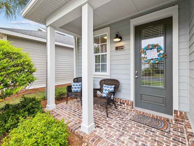 entrance to property featuring a porch