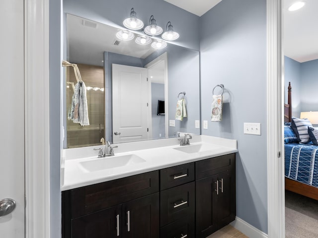 bathroom featuring oversized vanity and dual sinks