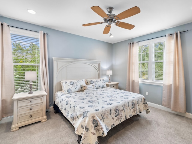 carpeted bedroom featuring ceiling fan