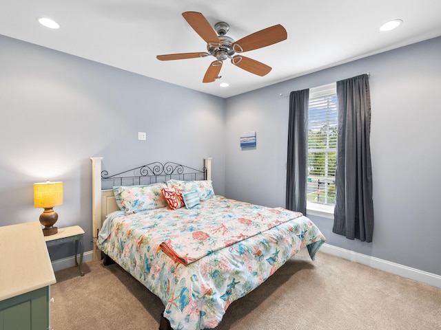 carpeted bedroom with ceiling fan