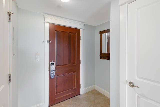 foyer entrance with light tile floors