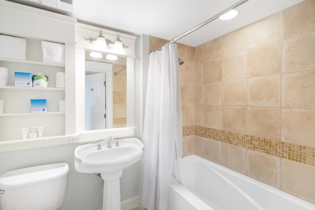 bathroom with shower / bath combination with curtain and toilet