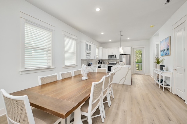 dining area featuring light hardwood / wood-style floors