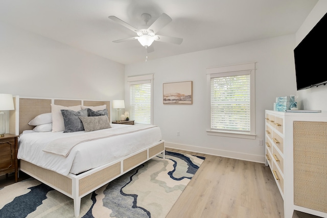 bedroom featuring light hardwood / wood-style flooring and ceiling fan