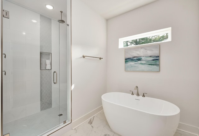 bathroom featuring tile flooring and separate shower and tub