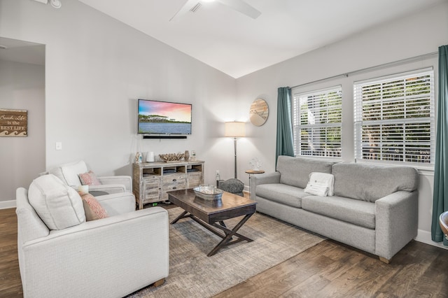 living room with lofted ceiling, ceiling fan, and dark hardwood / wood-style floors