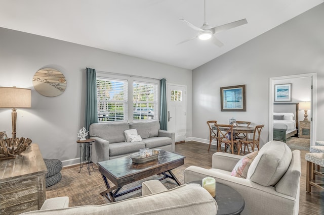 living room with high vaulted ceiling, dark hardwood / wood-style flooring, and ceiling fan