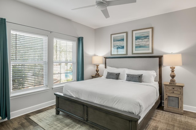 bedroom featuring dark hardwood / wood-style floors and ceiling fan