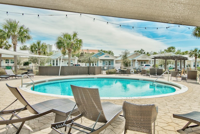 view of swimming pool with a patio area and a pergola