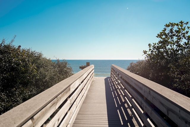 surrounding community featuring a water view