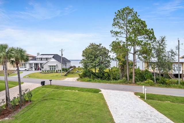 view of home's community with a lawn