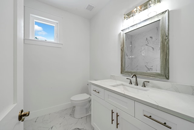 bathroom with toilet, vanity, visible vents, baseboards, and marble finish floor