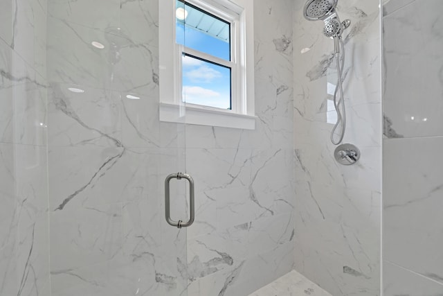 full bath with a marble finish shower