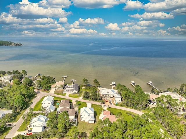 drone / aerial view with a water view and a residential view