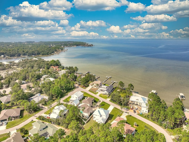 birds eye view of property with a residential view and a water view