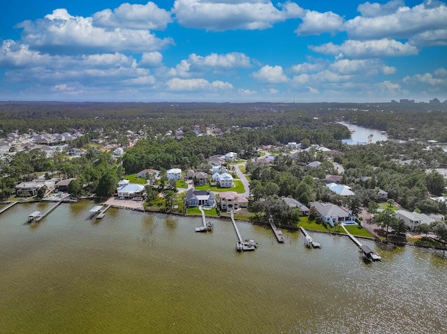 birds eye view of property featuring a water view and a residential view